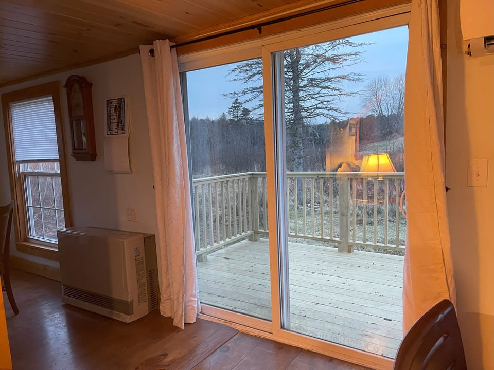 Patio doors leading to deck from living room.