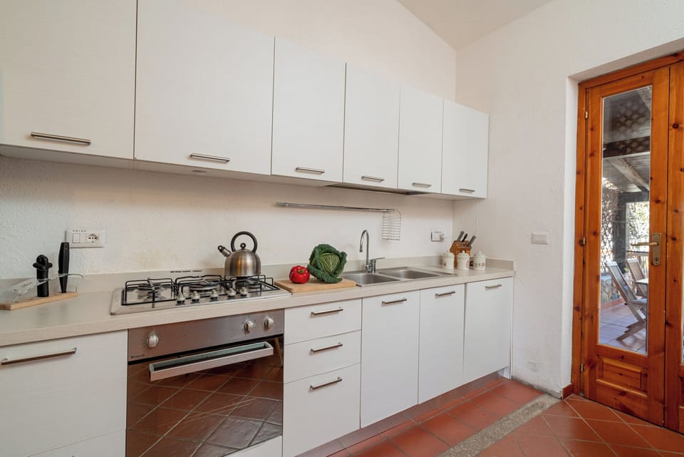Apartment, Garden View | Private kitchen | Full-size fridge, oven, stovetop, dishwasher