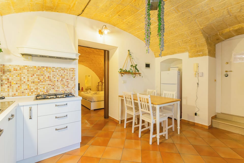 Apartment | Private kitchen | Electric kettle, dining tables