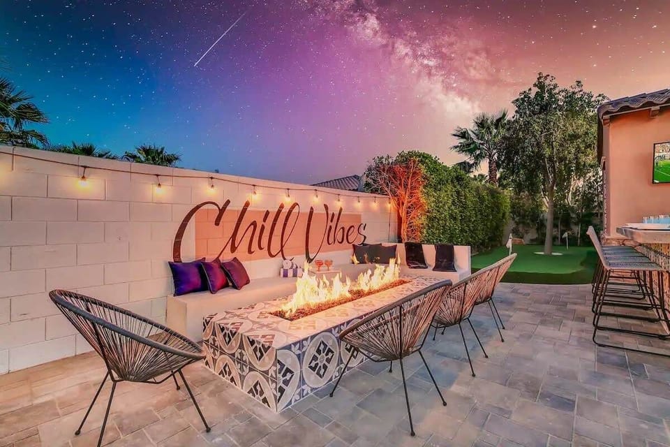Gather under the stars for unforgettable meals and late-night conversations at this cozy, stylish outdoor dining space.