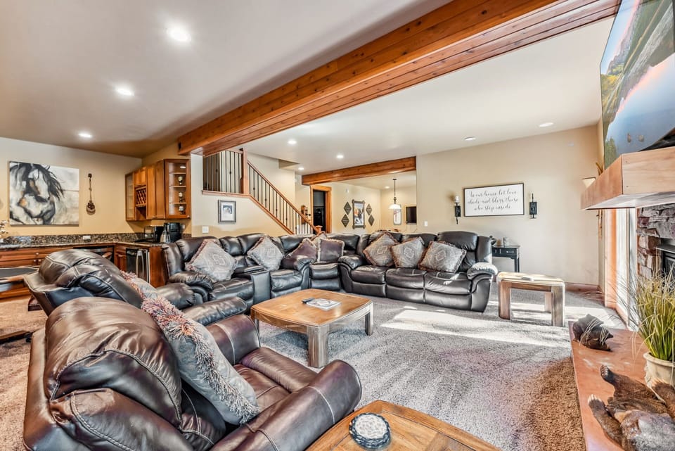 Bonus Room: Large leather couch, 2 chairs, fireplace, 70” TV, wet bar, table w/4 chairs, access to deck and hot tub