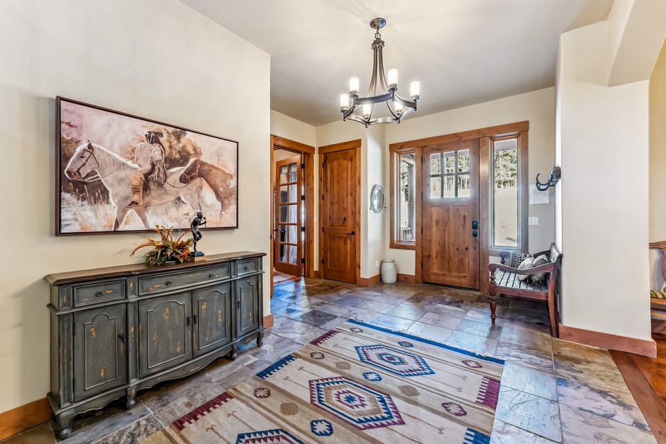 Entryway: Bench, coat rack, spacious area with ample storage space, half bath