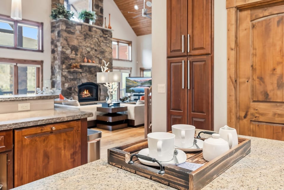 Prepare delicious meals in the fully-equipped kitchen outfitted with top-of-the-line stainless steel appliances and a large center island