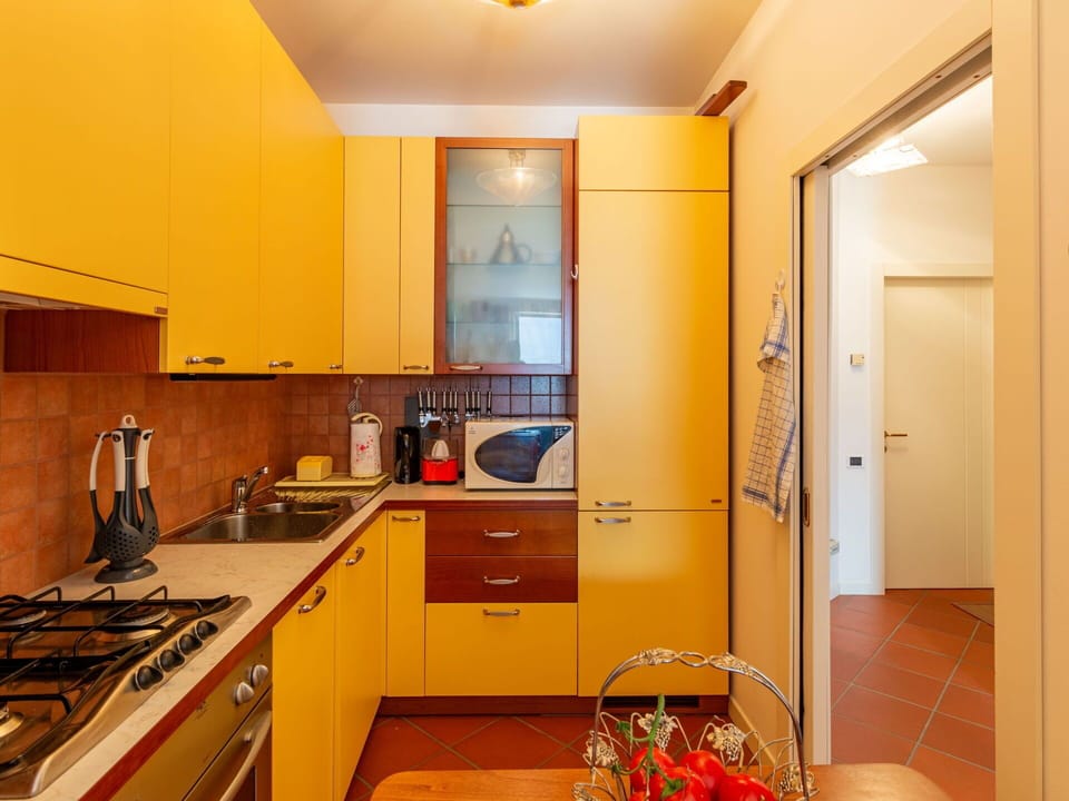 Cabinetry, Countertop, Property, Kitchen Sink, Building, Sink, Interior Design, Orange, Kitchen Appliance, Drawer