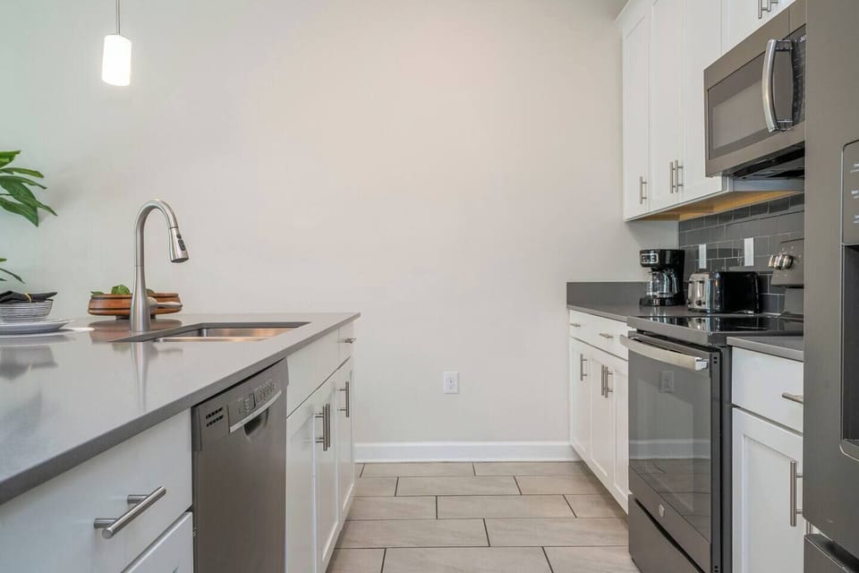 A fully equipped and comfortable kitchen ready for family gatherings where you can feel as cozy as home. Microwave, oven, dishwasher, refrigerator and stove available for you to cook.