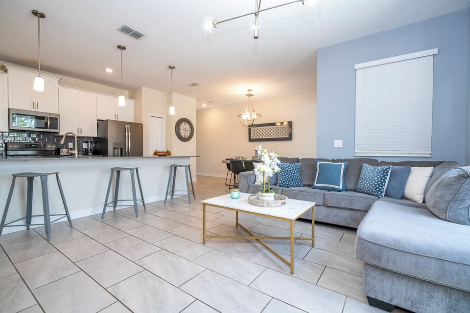 Open living space that seamlessly connects the beautiful kitchen and dining area, offering a perfect blend of comfort and style.