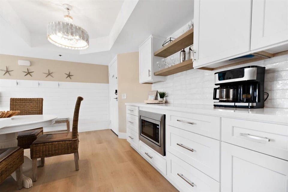Kitchen with drip/pod combo coffee maker and bar area to mix a cocktail