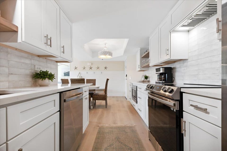 Updated kitchen with stainless appliances and quartz countertops.