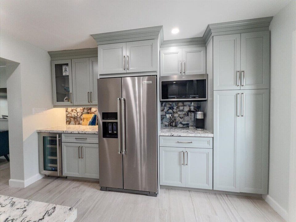 Bright, airy kitchen with natural light and stunning open water views.