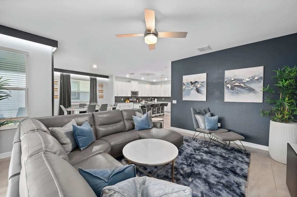 Open floor plan connecting the luxurious living room,  kitchen and dining room. Space for your whole group to be together!
