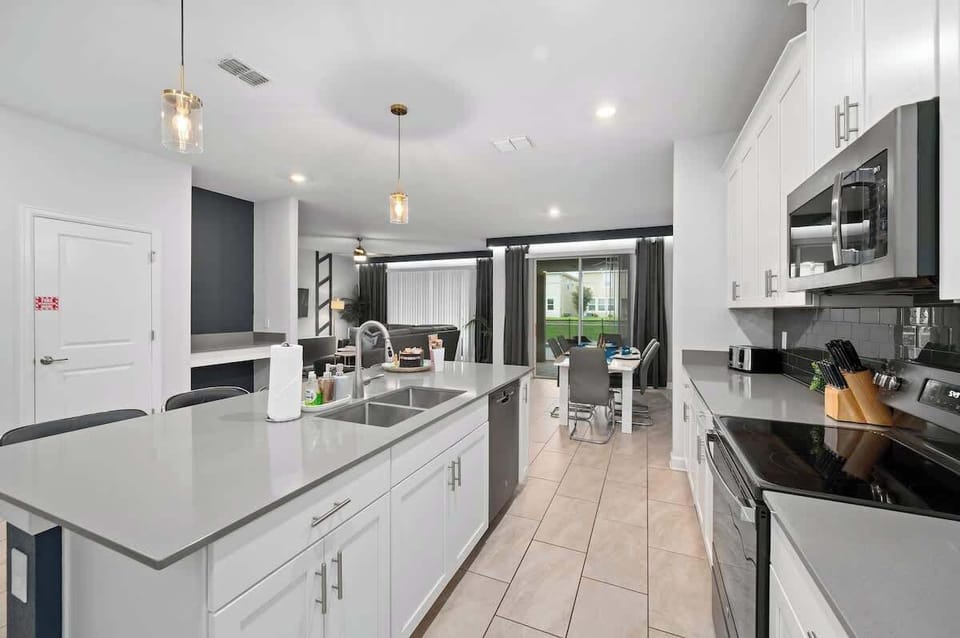 Large kitchen with all major appliances including refrigerator/freezer, oven, microwave, dish washer and coffee maker. Full sets of cook ware, dining ware and drink ware essentials. 