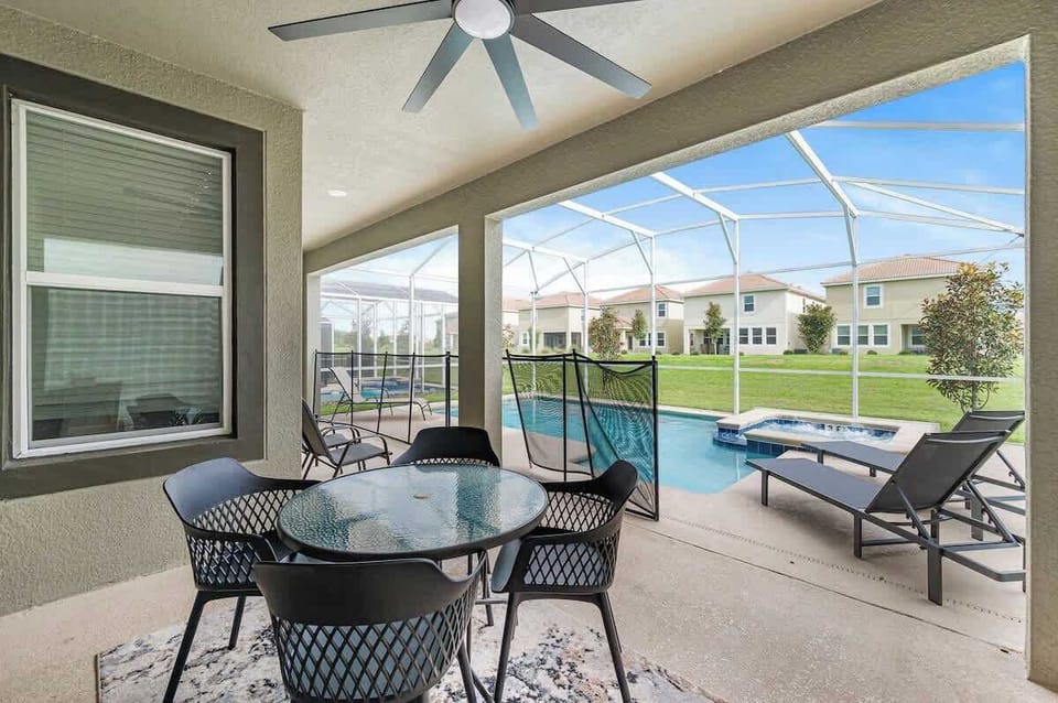 Outdoor dining area, sun loungers and safety gate