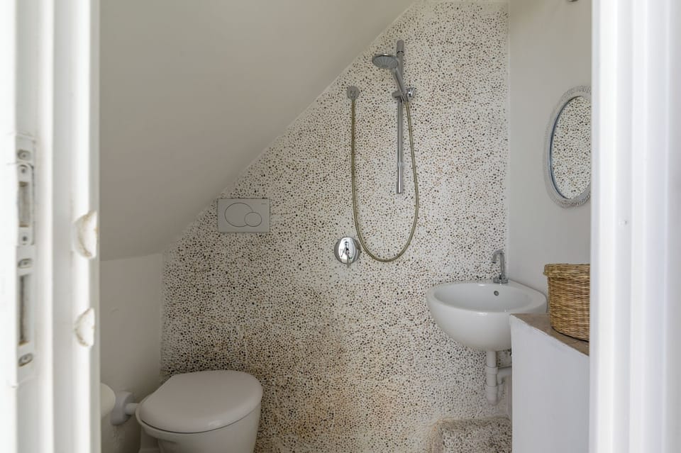 Apartment, Sea View | Bathroom | Shower, hair dryer, towels, soap