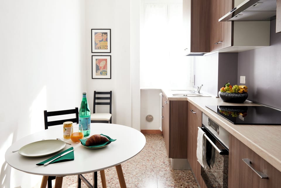 Deluxe Condo | Private kitchen | Full-size fridge, microwave, espresso maker, coffee/tea maker
