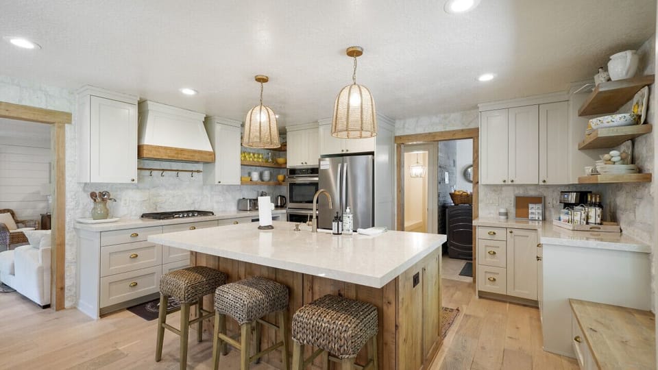 Where rustic charm meets modern convenience: a cozy kitchen with a classic countertop stove and charming cupboards.