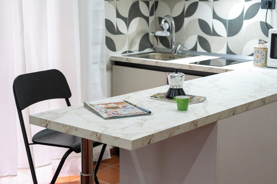 Apartment | Private kitchen | Electric kettle, dining tables