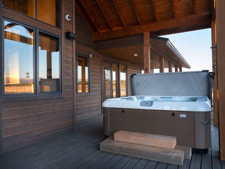 Enjoy the incredible view from hot tub conveniently located on the deck space and covered by the roofline and not exposed to elements