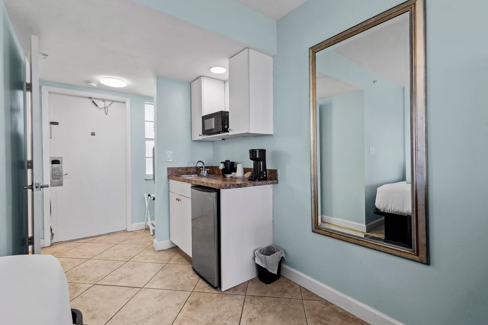 Amenities include a smart TV with cable, a mini fridge, a microwave, and a coffee maker.