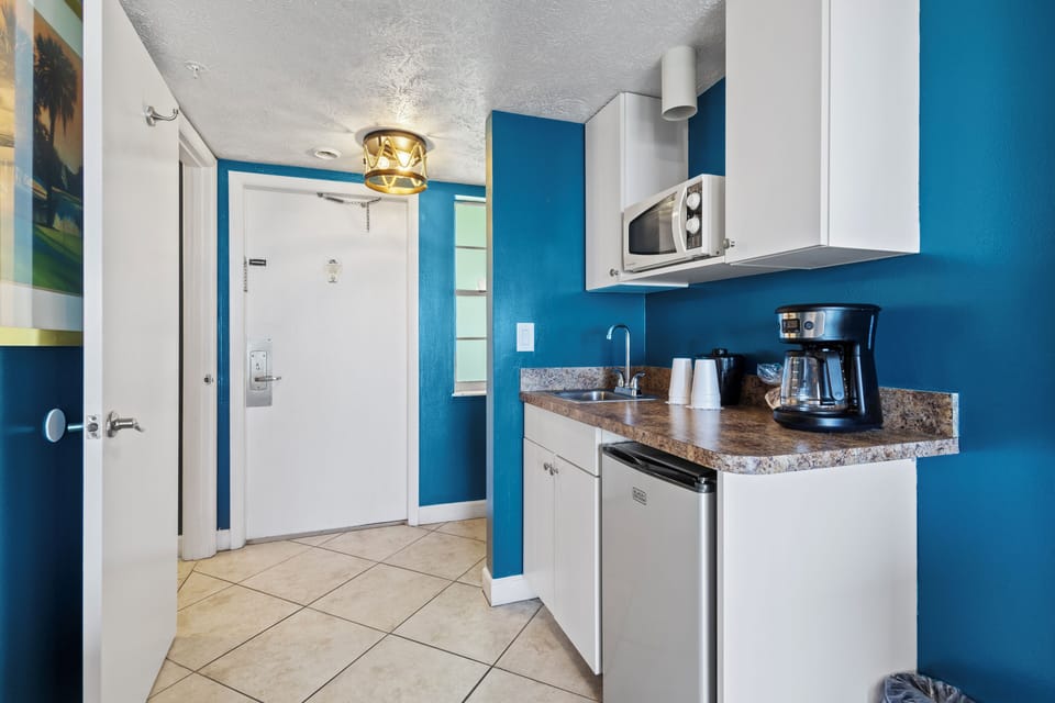 Amenities include a smart TV with cable, a mini fridge, a microwave, and a coffee maker.