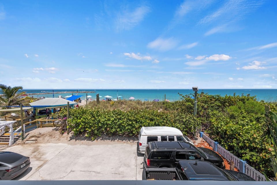 The view from the room overlooks the ocean, beach, and peaks of the Fort Pierce Inlet.