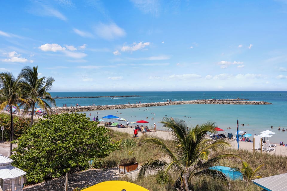 The view from the room overlooks the ocean, beach, and view of the Fort Pierce Inlet.