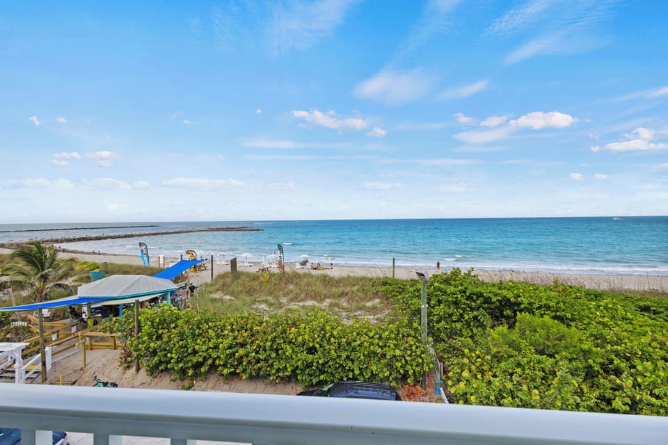 The view from the room overlooks the ocean, beach, and view of the Fort Pierce Inlet.
