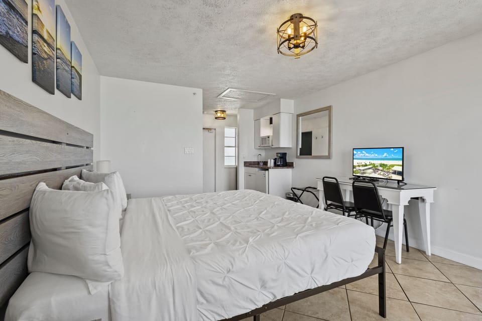Amenities include a smart TV with cable, a mini fridge, a microwave, and a coffee maker.