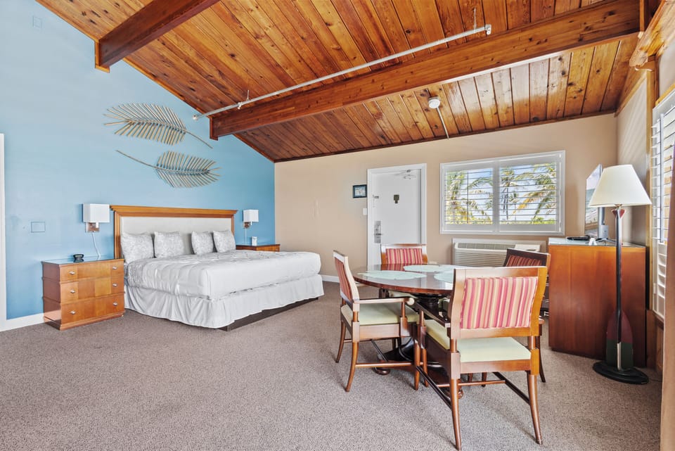 Comfortable rustic charm with vaulted wood ceilings and coastal colors and decor.