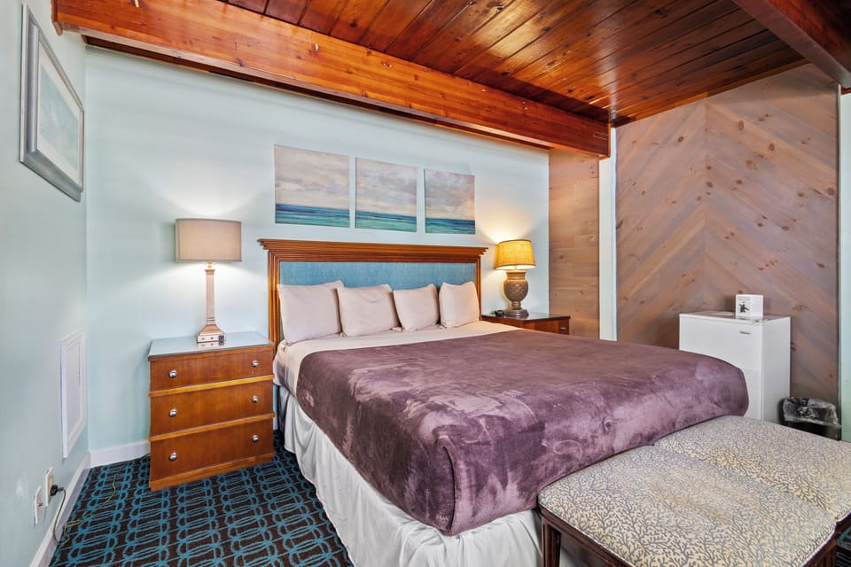 Amenities include a smart TV with cable, a mini fridge, a microwave, and a coffee maker.