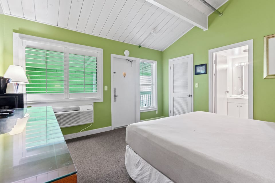 Comfortable rustic charm with wood ceilings and coastal colors and decor.