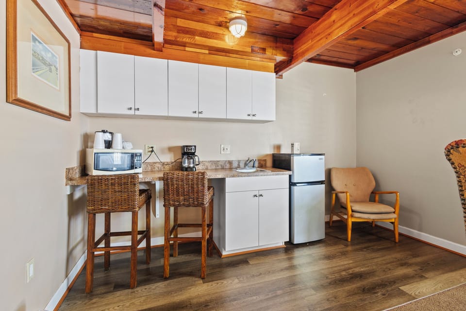 Amenities include a smart TV with cable, a mini fridge, a microwave, and a coffee maker.