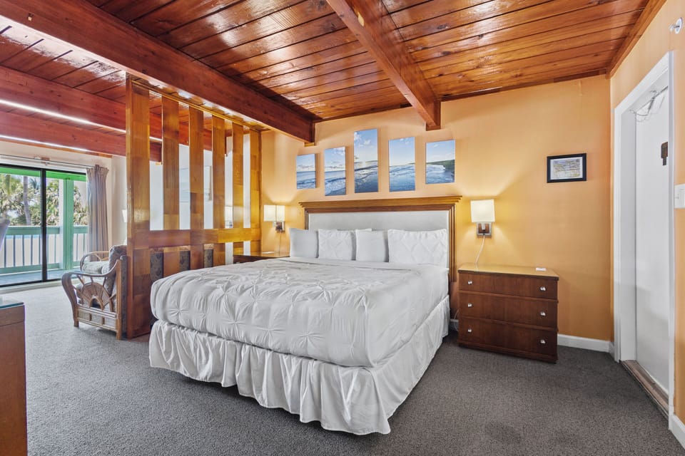 Room 6 is located on the second floor of the Inlet Building. It has a king-size bed, sofa, dining table and a sliding door overlooking the inlet park.