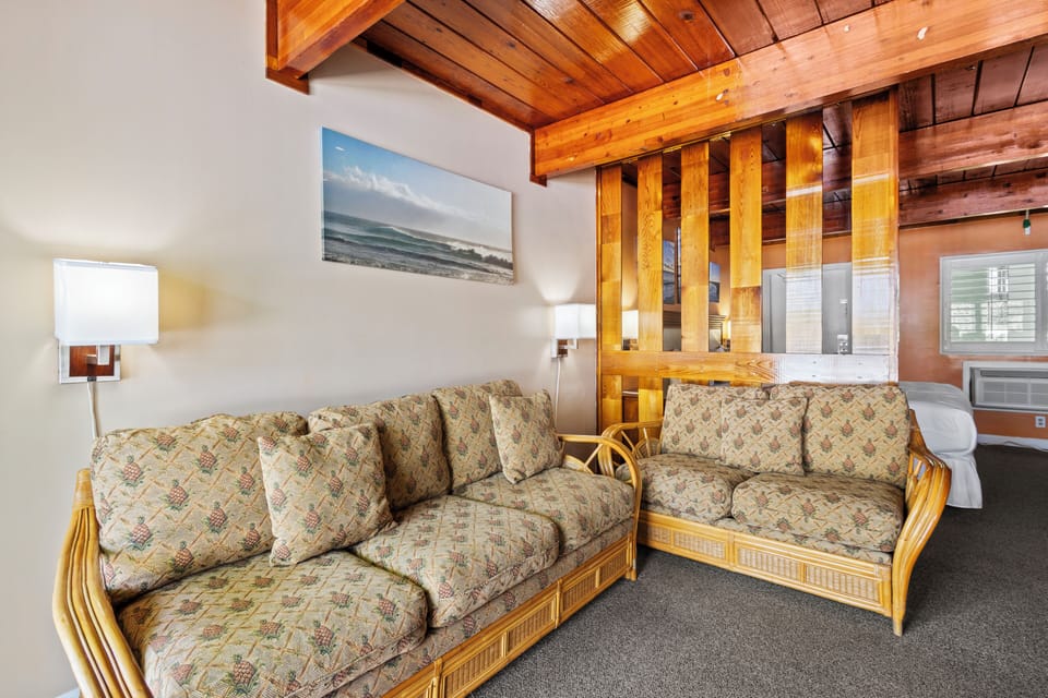Room 6 has a living area with two sofas one of which has a pull out bed.