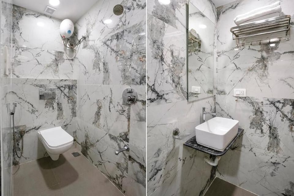 Deluxe Room | Bathroom | Hair dryer, slippers