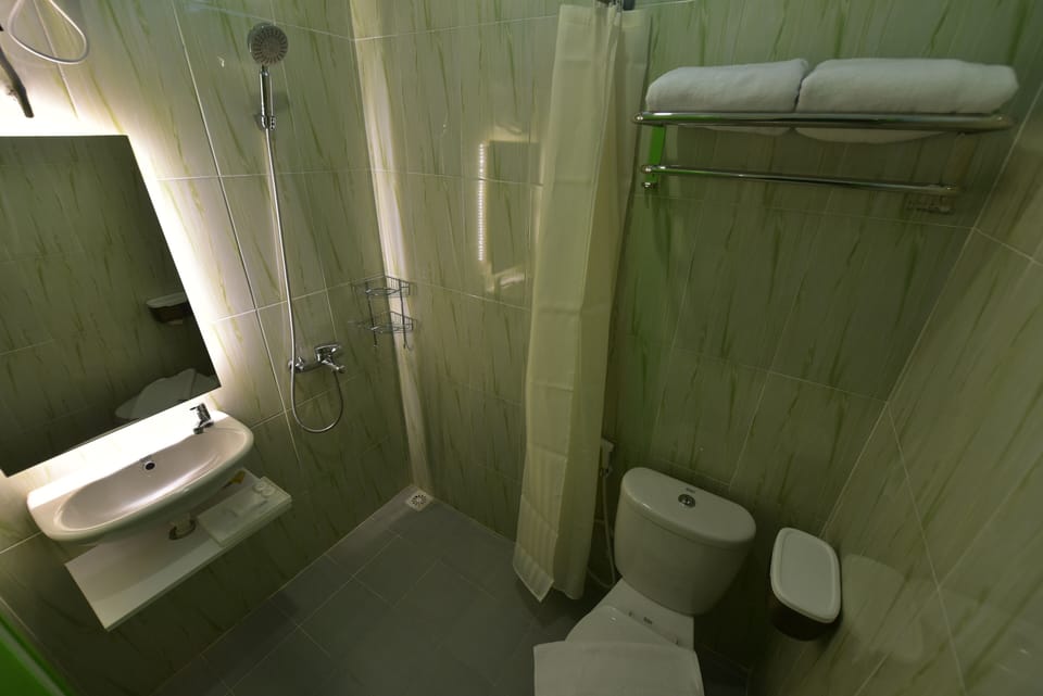 Superior Single Room, 1 Large Twin Bed | Bathroom | Shower, free toiletries, towels, soap