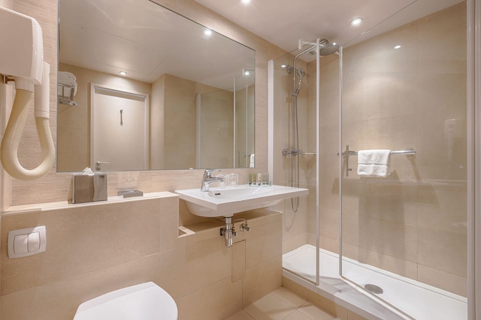 Shower, free toiletries, hair dryer, towels
