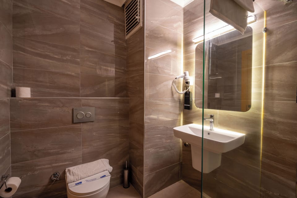 Shower, rainfall showerhead, eco-friendly toiletries, hair dryer