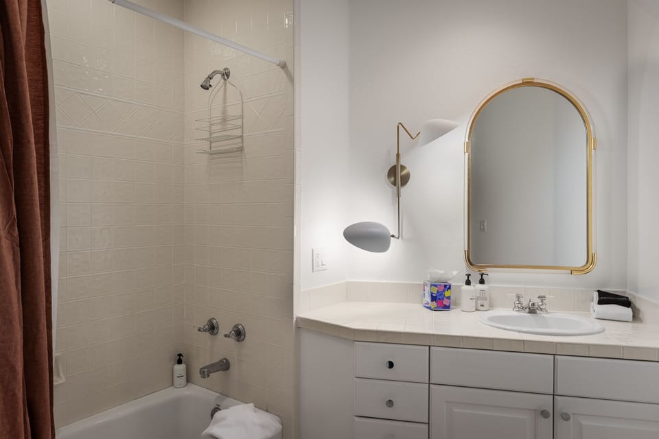 Bathroom 3 - Guest Bathroom - Ensuite bathroom with single vanity and tub/shower combo