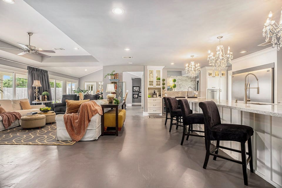 Beautiful open kitchen/living area with unobstructed view to pool/backyard.