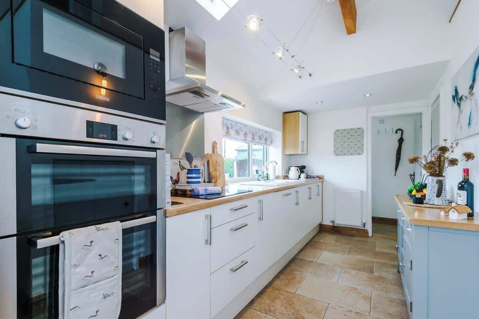 The large kitchen is fully equipped with everything you need for your long or short stay with us. There is an electric hob, double oven, fridge freezer, dishwasher, Coffee machine, microwave, toaster, kettle, washing machine & dryer. 