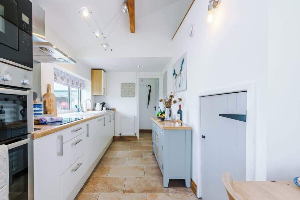 The large kitchen is fully equipped with everything you need for your long or short stay with us. There is an electric hob, double oven, fridge freezer, dishwasher, Coffee machine, microwave, toaster, kettle, washing machine & dryer. 