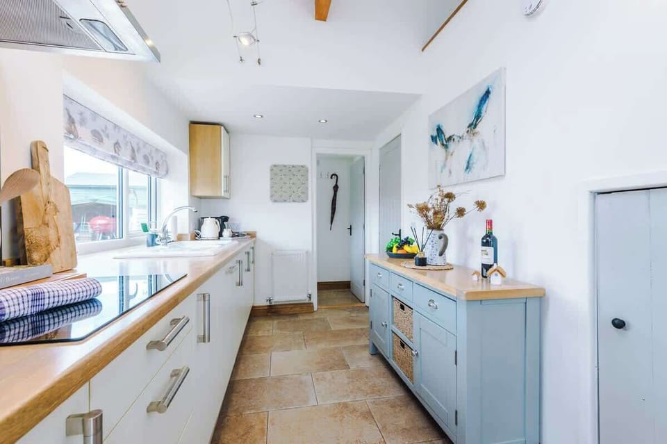 The large kitchen is fully equipped with everything you need for your long or short stay with us. There is an electric hob, double oven, fridge freezer, dishwasher, Coffee machine, microwave, toaster, kettle, washing machine & dryer. 