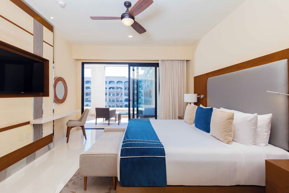 Beautifully decorated master bedroom with a king size bed, access to the terrace