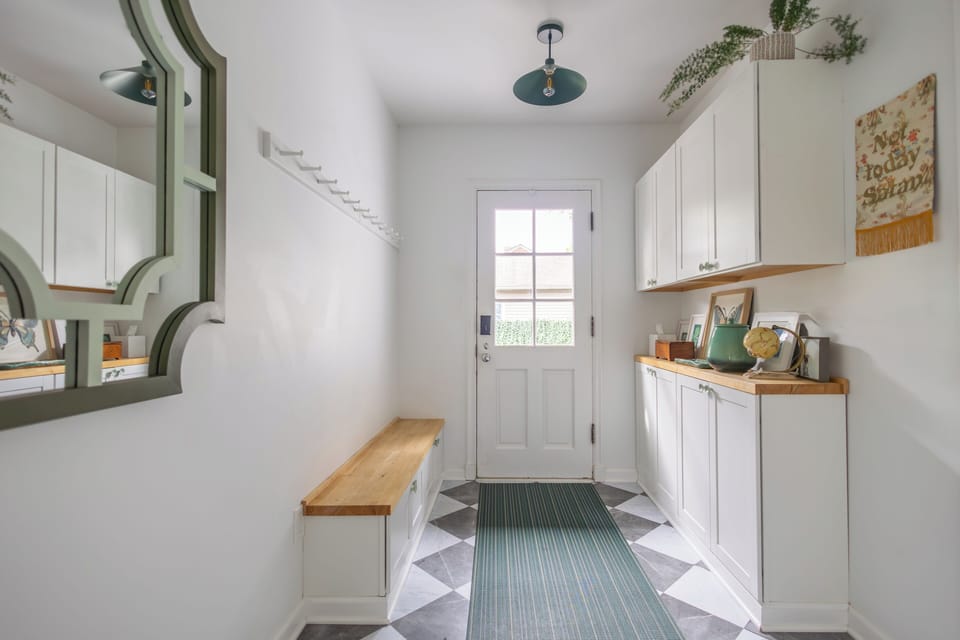 Back door mudroom entry to driveway and pergola.
