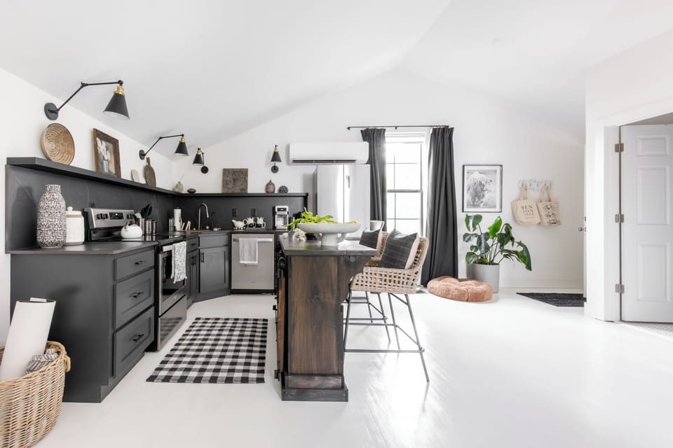 View of newly renovated kitchen and custom bar area with seating for two