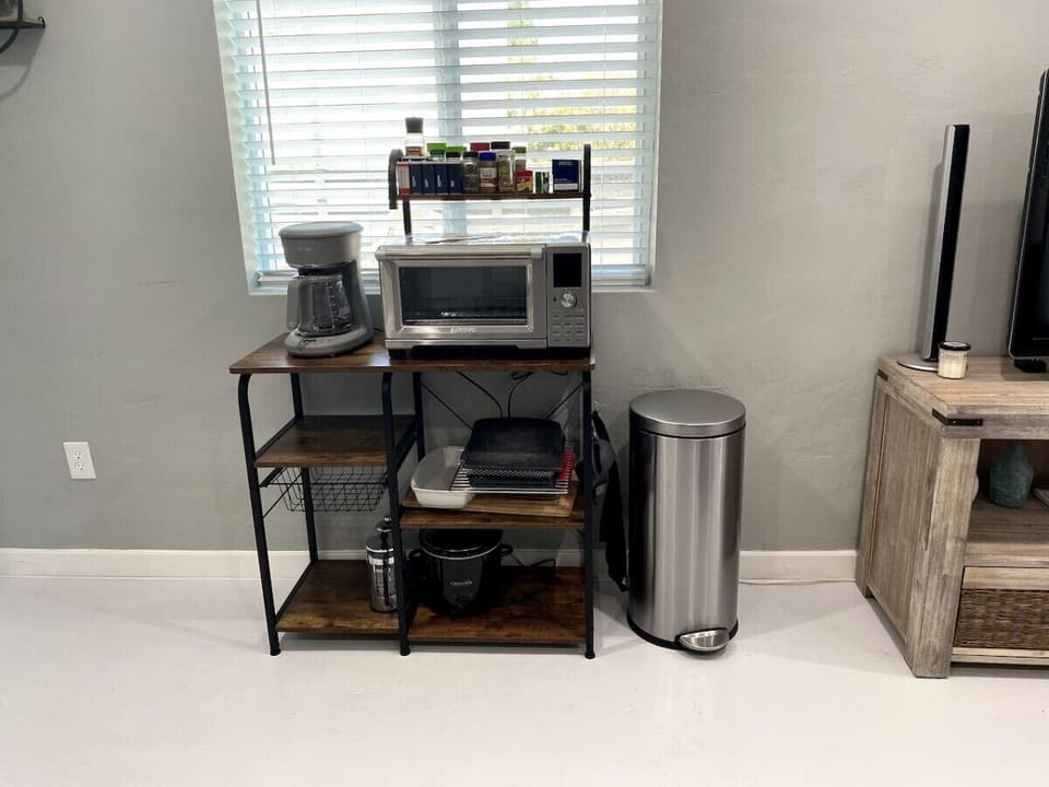 Well-equipped kitchenette with coffee station, toaster oven, and hot plate