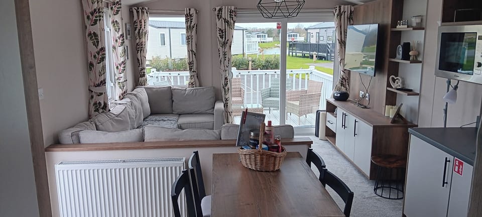 Bright and airy room. With smart tv, cd player, Bluetooth speaker,  DVD player, sofa bed, large seating area.