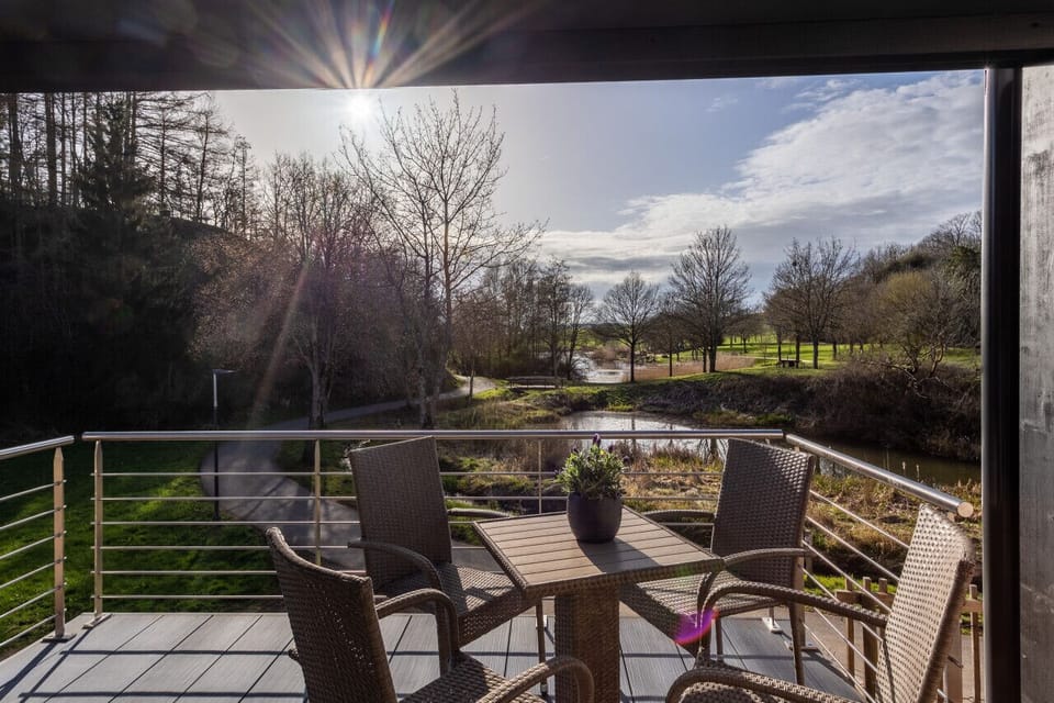 Spacious deck overlooking a serene lake — the ideal spot to soak in nature.