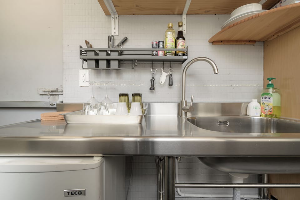 Kitchenette: 
• Microwave 
• Toaster Oven 
• Kettle 
• Fridge 
• Dinnerware 
