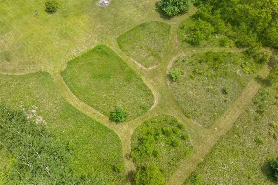 Explore the expansive grounds at Serenity Acres, complete with a fun disc golf course and beautiful walking trails. Enjoy the stunning natural surroundings and wide-open spaces perfect for outdoor activities.